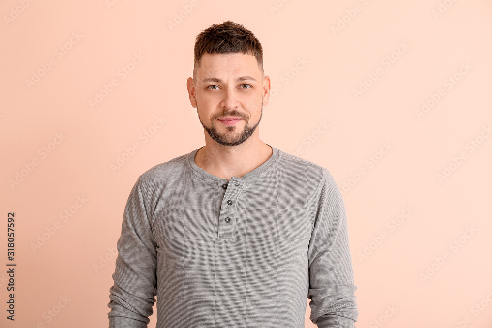 Handsome man on color background