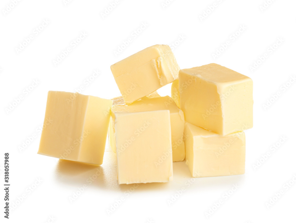 Pieces of fresh butter on white background