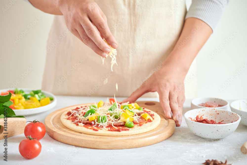 Step-by-step boss makes a pizza margarita. Dough and pizza ingredients