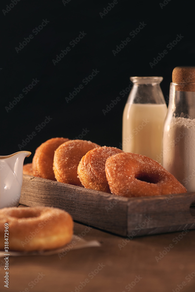 Sugar donuts with a glass of milk