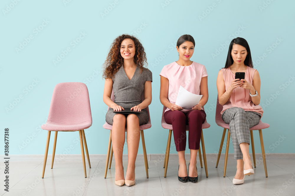 Young women waiting for job interview indoors