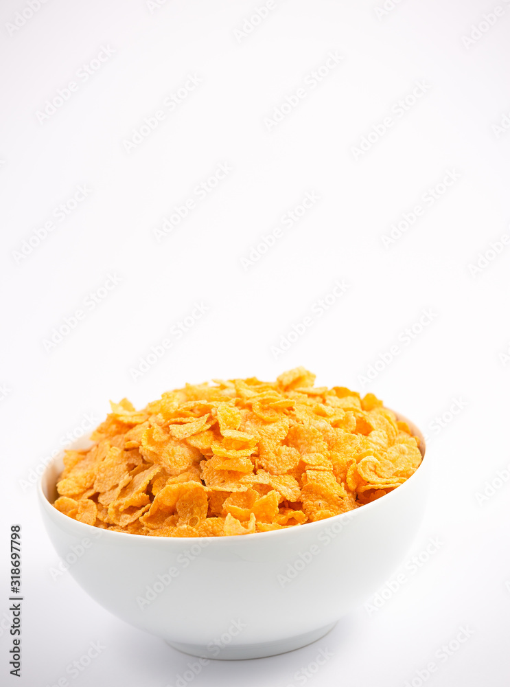 Natural corn flake breakfast cereal in cups and milk is a healthy breakfast that is good for your bo