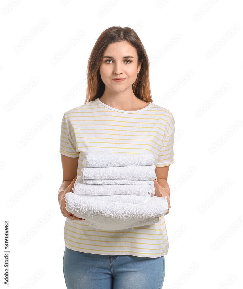 Beautiful young woman with laundry on white background