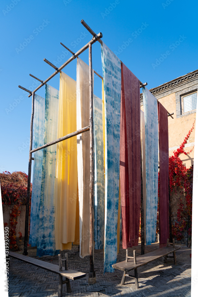 Yongshun Dyeing Workshop, Beijing Wtown（Gubei Water Town）, China. Colorful cloths hanging to dry in 