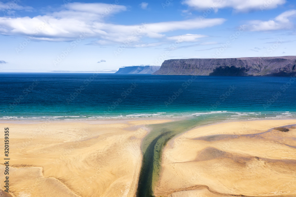 Iceland. Aerial view on the coast line, mountains and ocean. Beach and sea from air. Famous place in