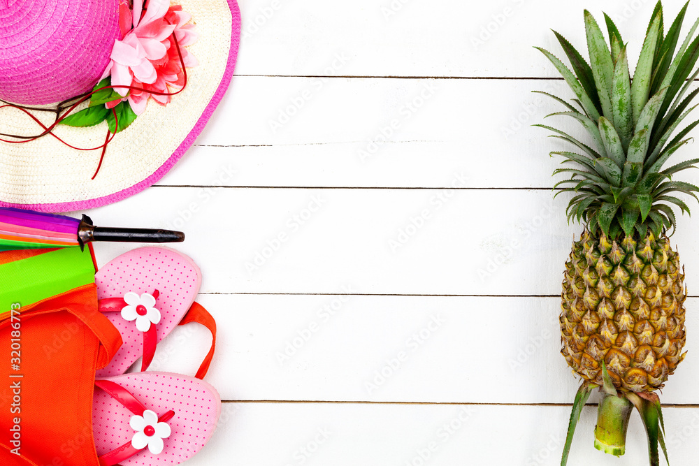 Summer objects of pineapple,lady hat,Flip flops umbrella with sunglasses summer accessory on white w