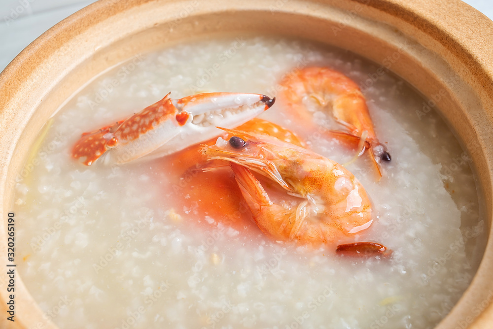 Chinese Chaoshan casserole porridge, a pot of shrimp and crab seafood porridge on the kitchen counte