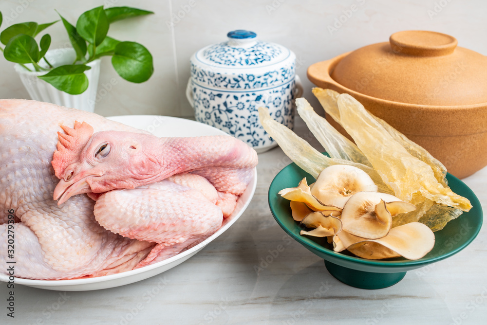 Ingredients of Chinese tonic health soup, fresh hen and snail shell