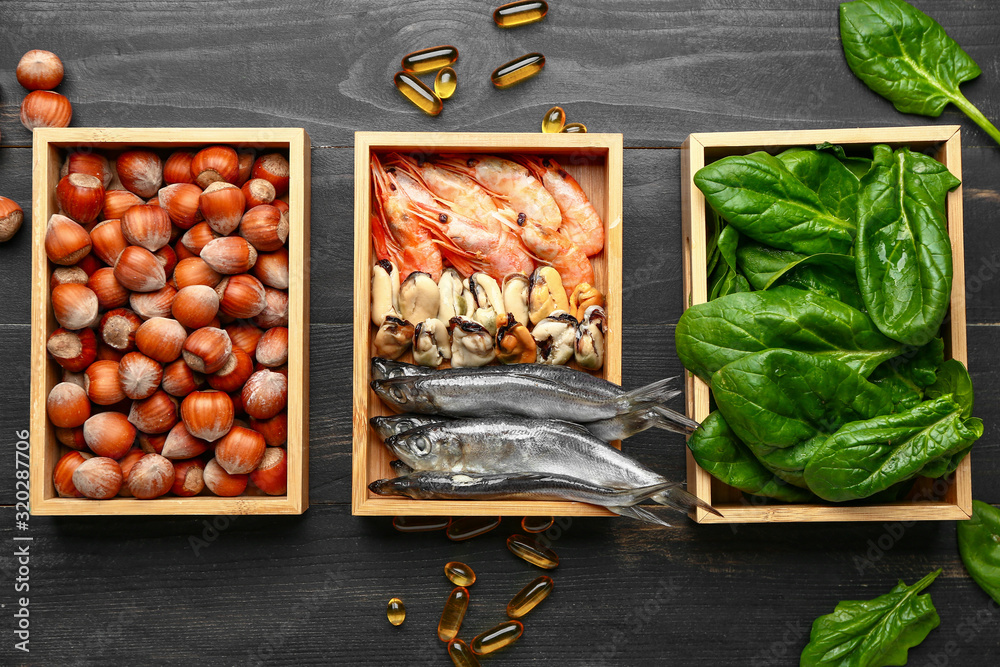 Healthy products rich in omega-3 on wooden background