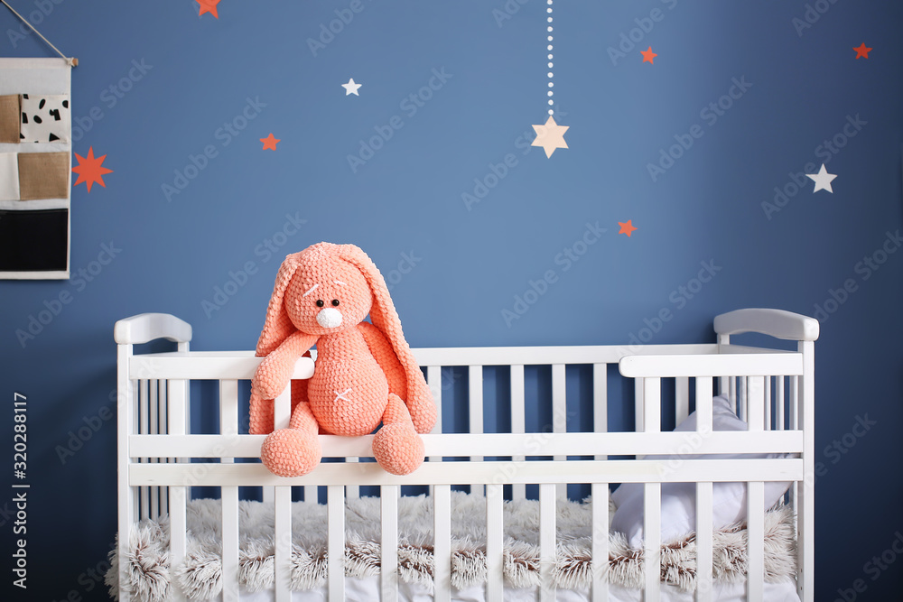 Cute baby toy on crib