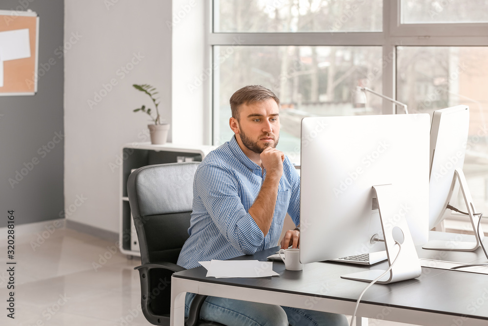 Male programmer working in office