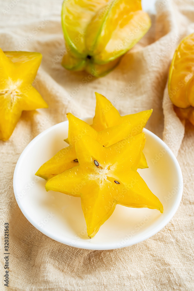 Golden yellow fresh carambola and pulp slices