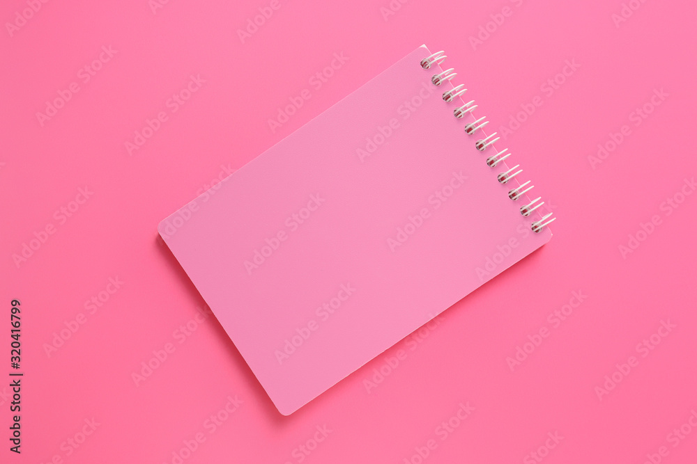 School notebook on color background