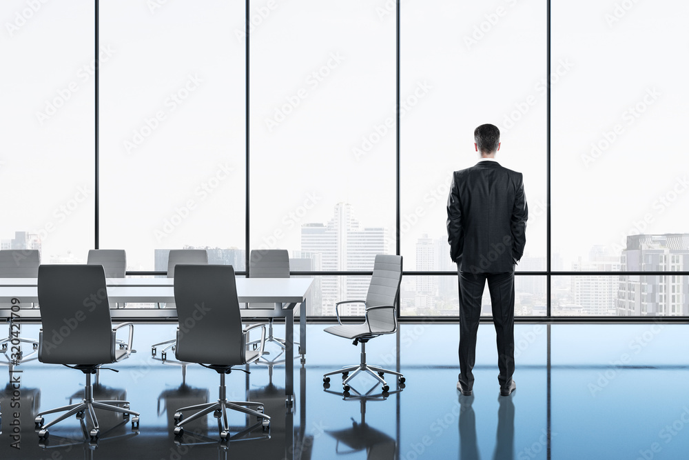 Businessman standing in meeting room