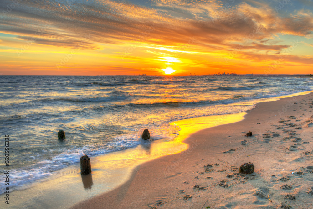 Beautiful beach of the Baltic Sea at sunset in Gdansk, Poland