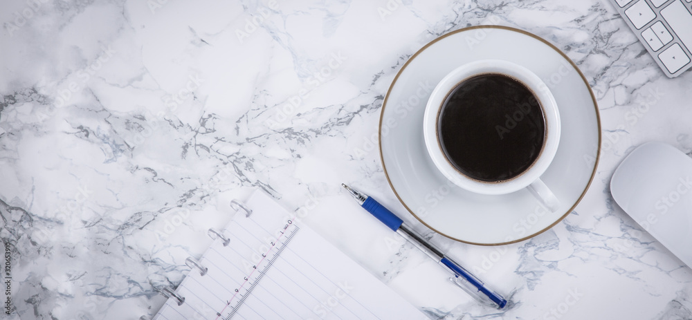 Black coffee on the desk with a computer, mouse Keyboard, book note, and pen Concept of working at h