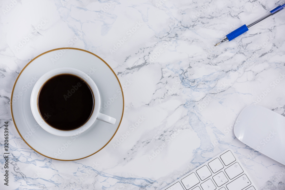 Black coffee on the desk with a computer, mouse Keyboard, book note, and pen Concept of working at h