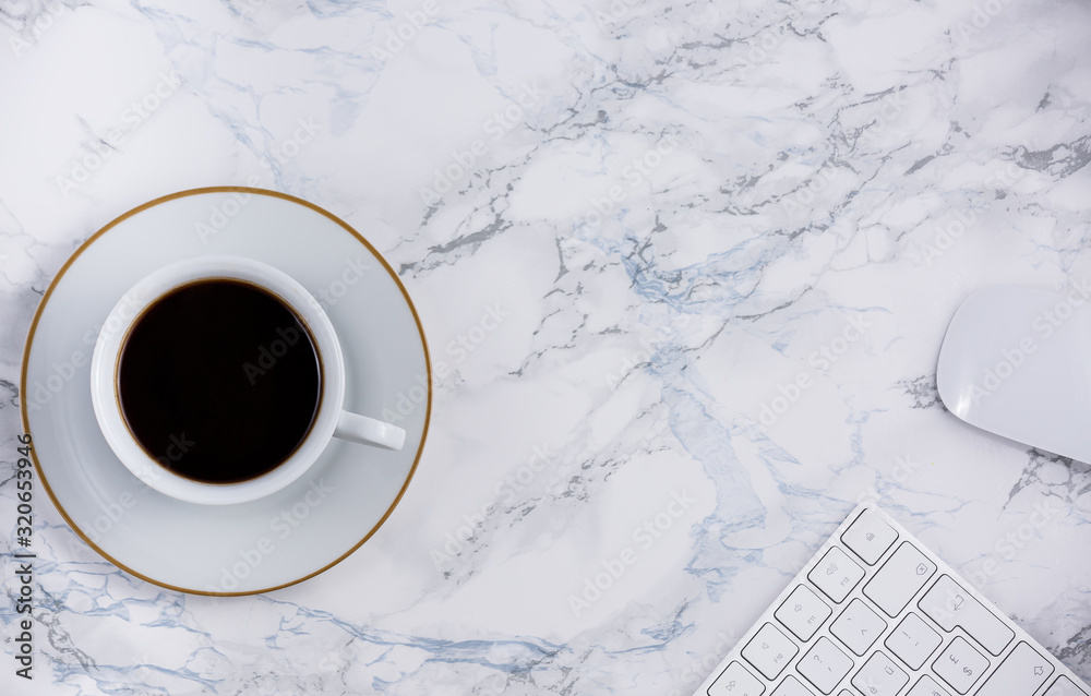 Black coffee on the desk with a computer, mouse Keyboard, book note, and pen Concept of working at h