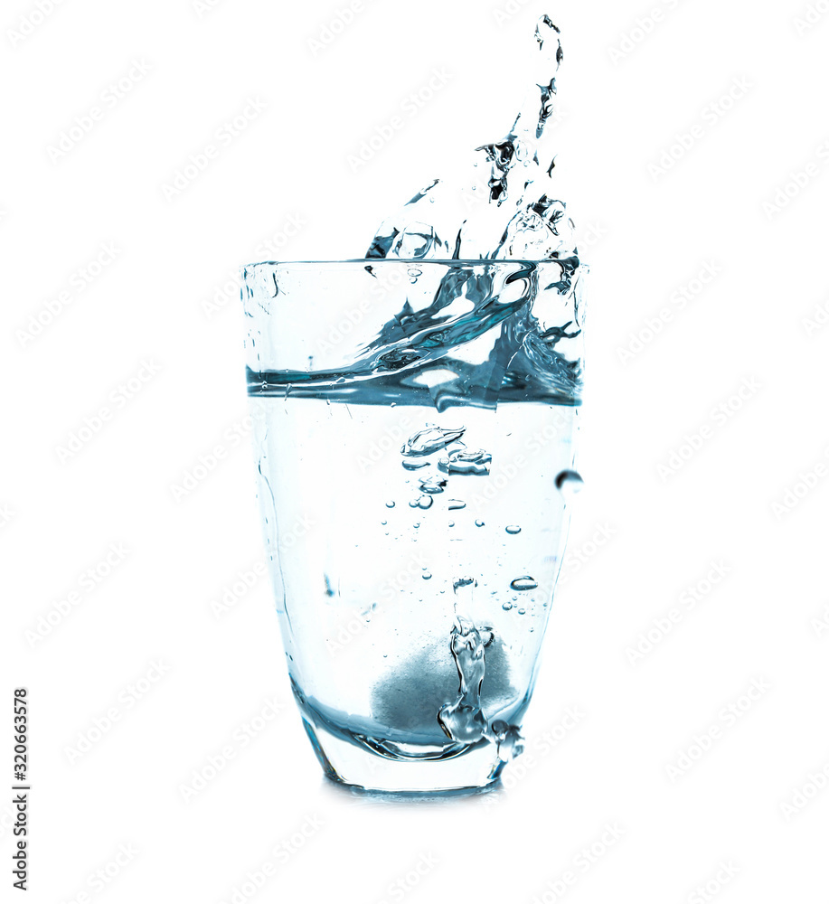 Glass of fresh water with splash on white background