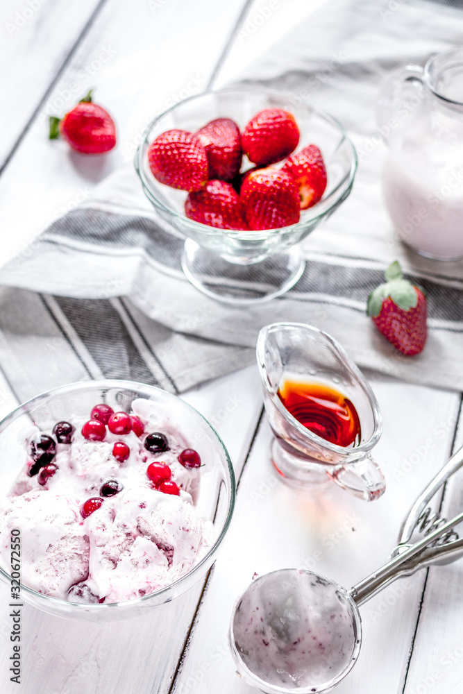 organic homemade ice cream in glass bowl on wooden background