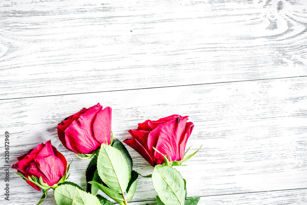 concept Valentines Day with flower wooden background top view