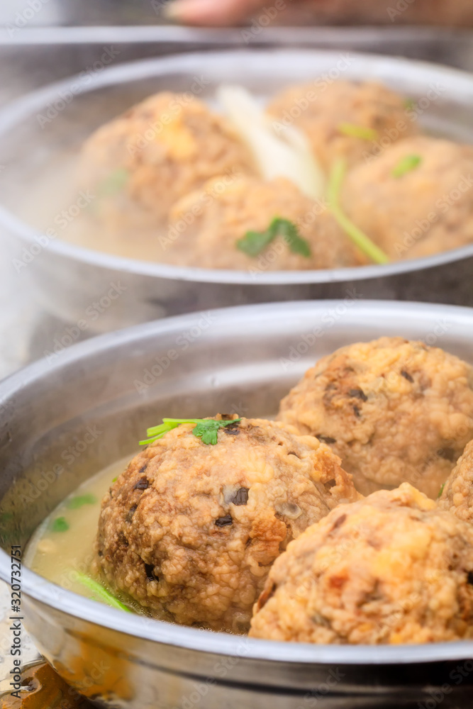 Cooked deep-fried meatballs made from cooked pork and cooked rice.Chinese food.