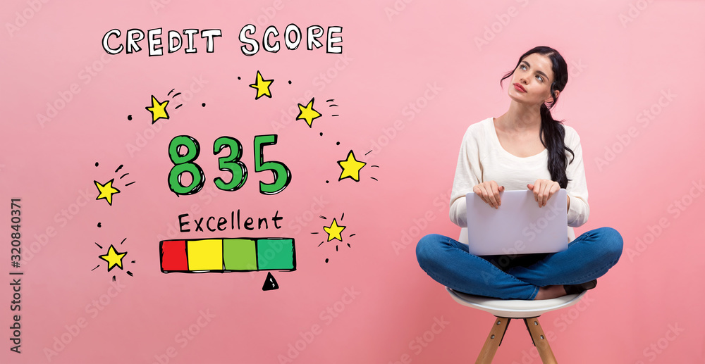 Excellent credit score theme with young woman using a laptop computer