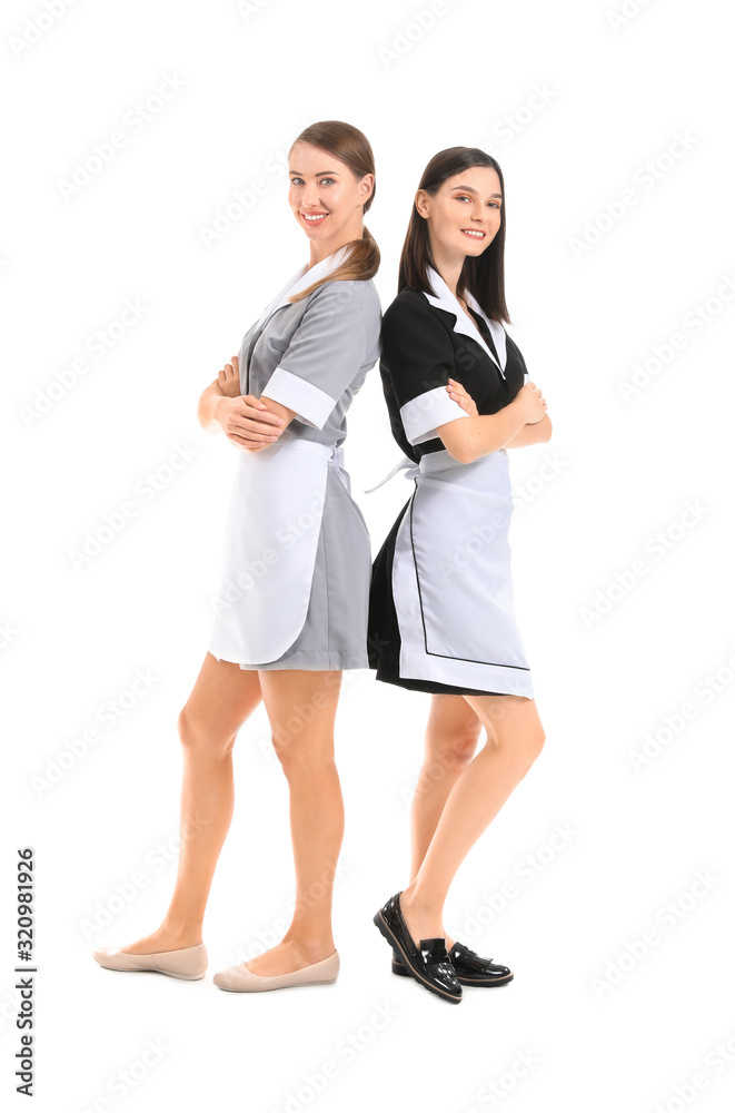 Portrait of beautiful chambermaids on white background