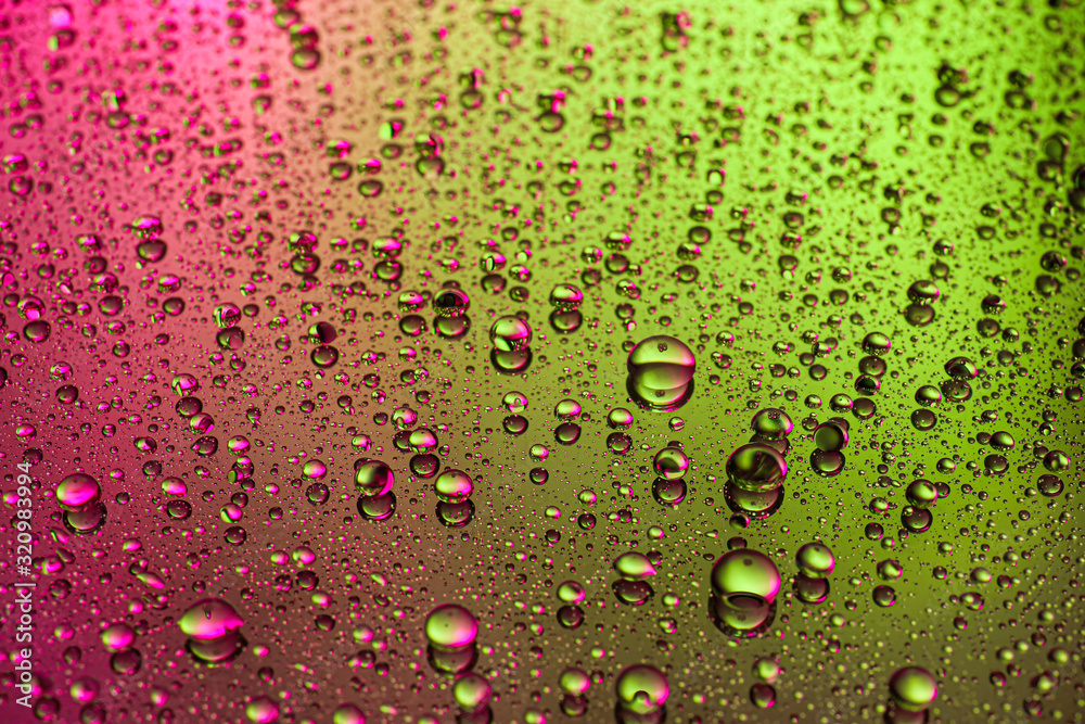 Drops of water on color background