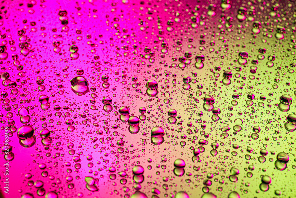 Drops of water on color background