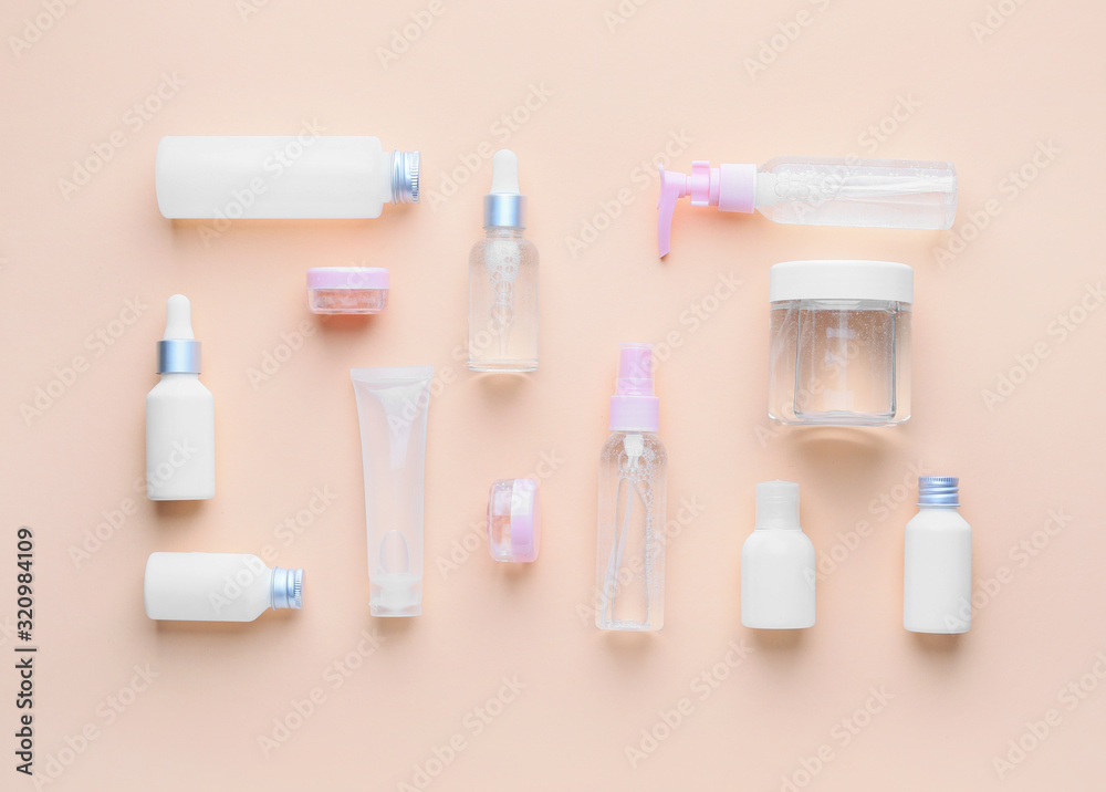 Different cosmetic products on color background