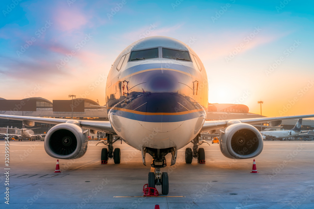 Airliner on airport runway and apron..