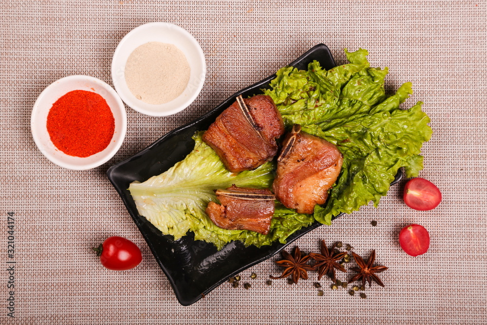 The fresh wild spareribs are roasted, sliced into different shapes and put on the plate