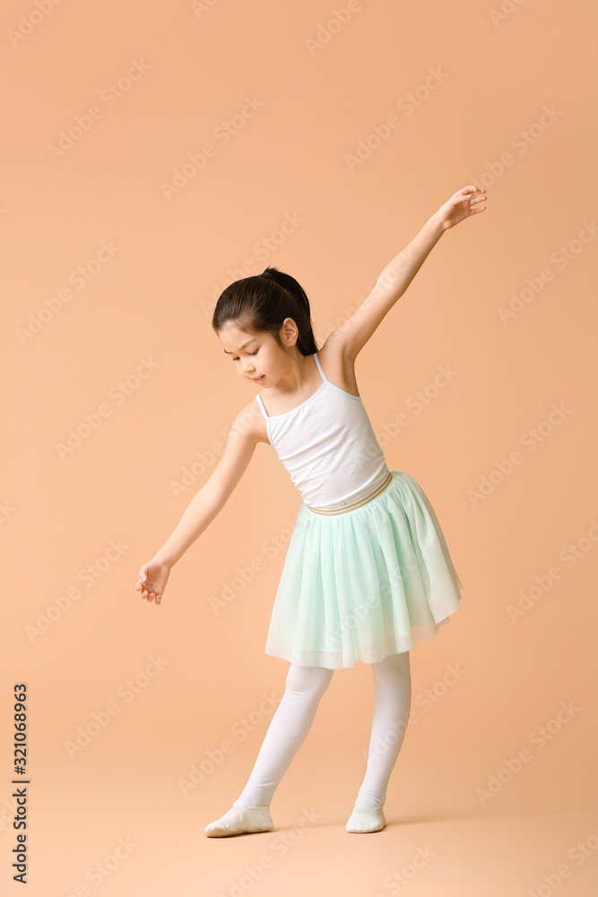 Cute little ballerina on color background