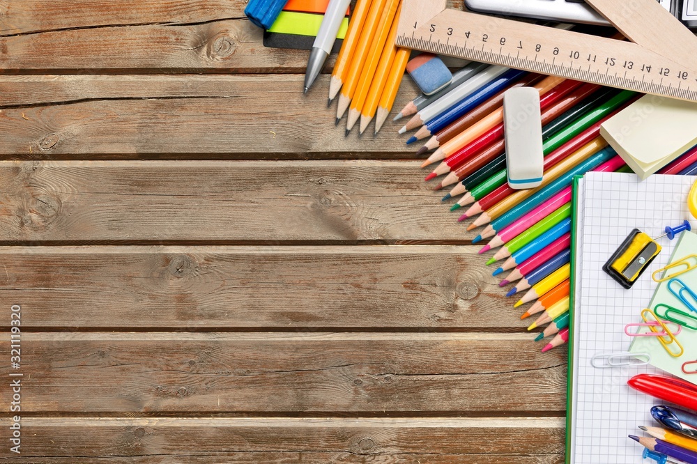 An assortment of colored school supplies on the desk