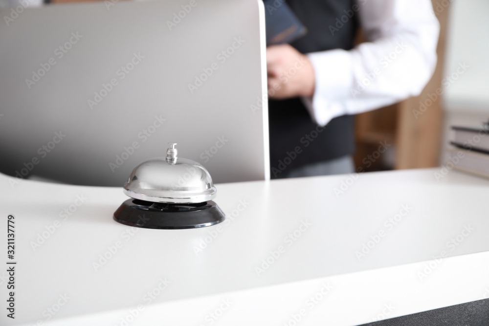 Service bell on reception desk in hotel