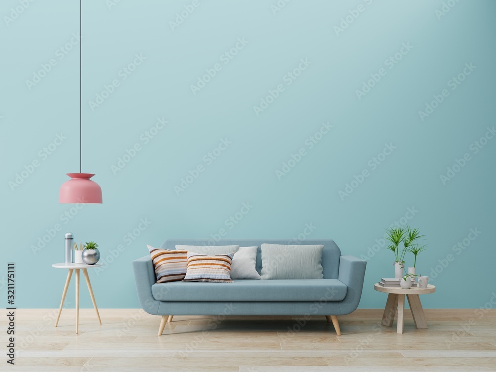 Modern living room interior with sofa and green plants,lamp,table on blue wall background.