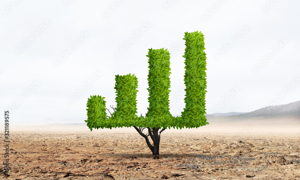 Green plant in shape of growth financial graph