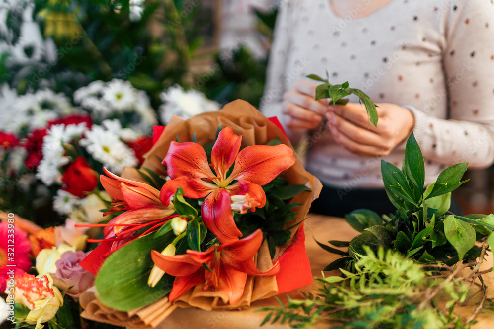 Beautiful lily bouquet on a counter at florist store.