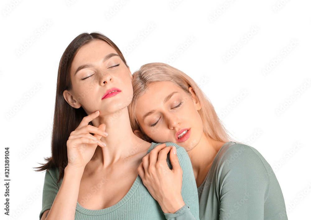 Young women with beautiful makeup on white background