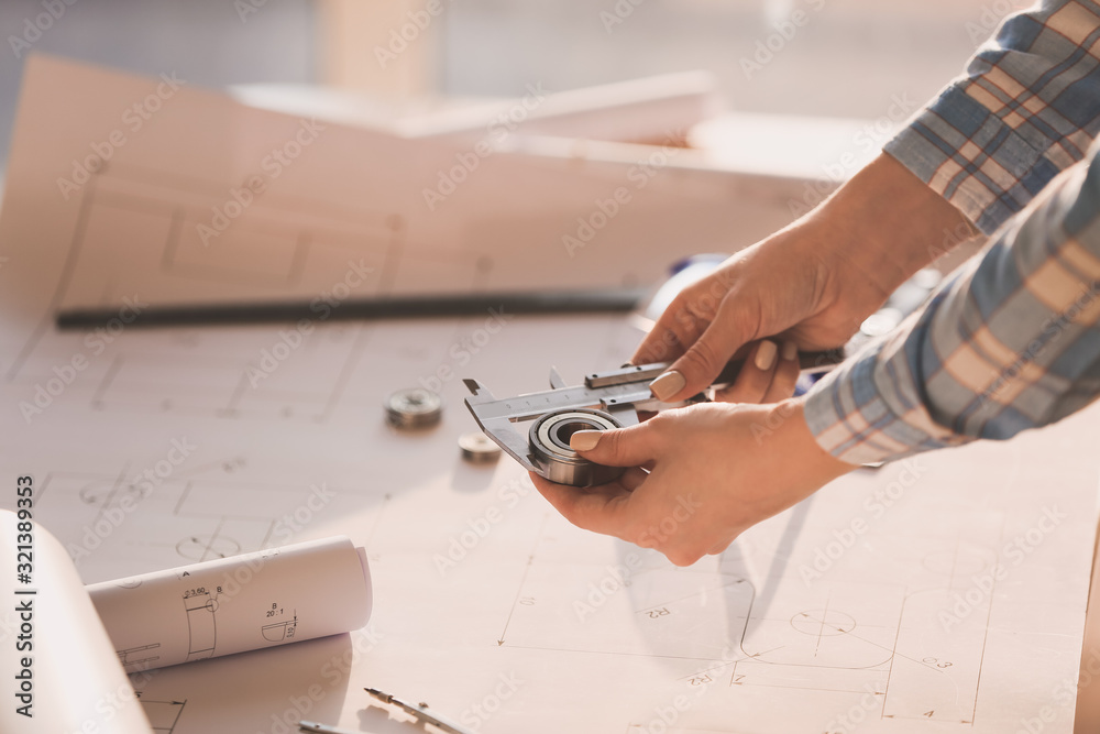 Female architect working in office