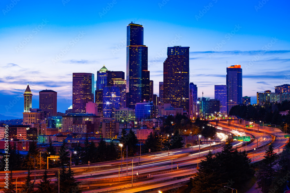 Illuminated view of Seattle downtown over I5 interstate highway during dusk from Dr. Jose Rizal Park