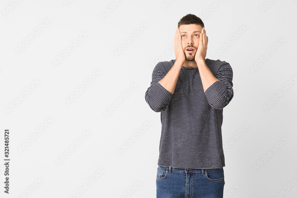 Stressed man on light background. Concept of choice