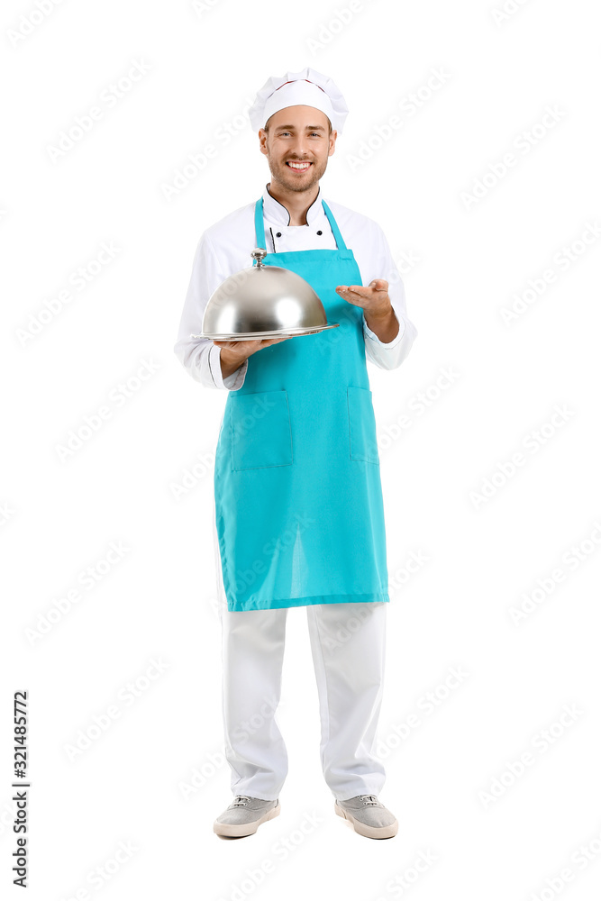 Handsome male chef with tray and cloche on white background