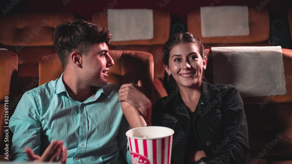 People audience watching movie in the movie theater cinema. Group recreation activity and entertainm