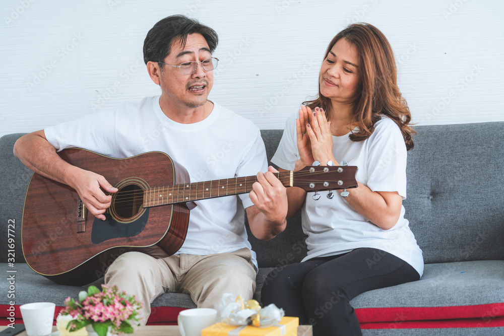 Happy Asian senior couple having good time at home. Old people retirement and healthy citizens elder