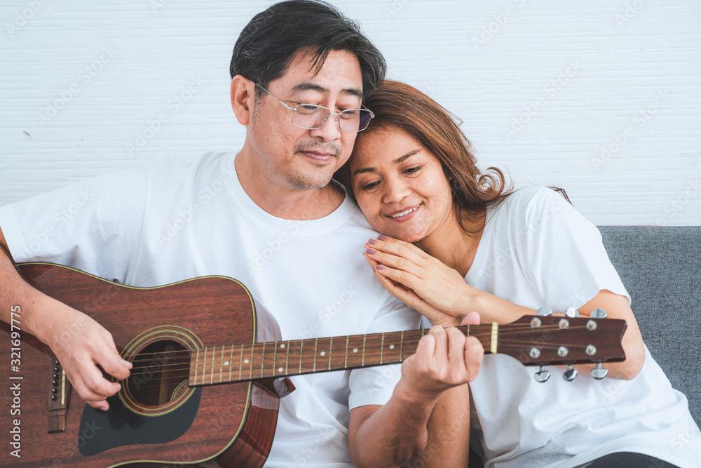 Happy Asian senior couple having good time at home. Old people retirement and healthy citizens elder