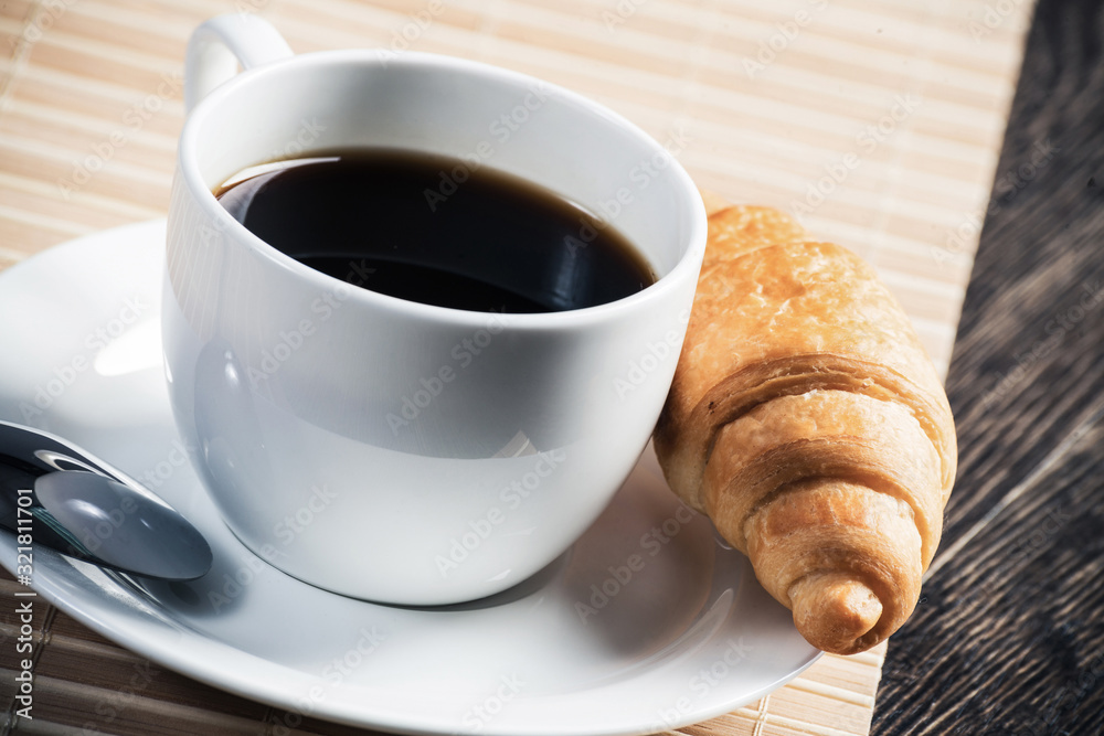 Cup of espresso coffee on wooden table