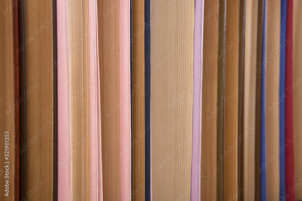 Colorful hardback and paperback books, close-up