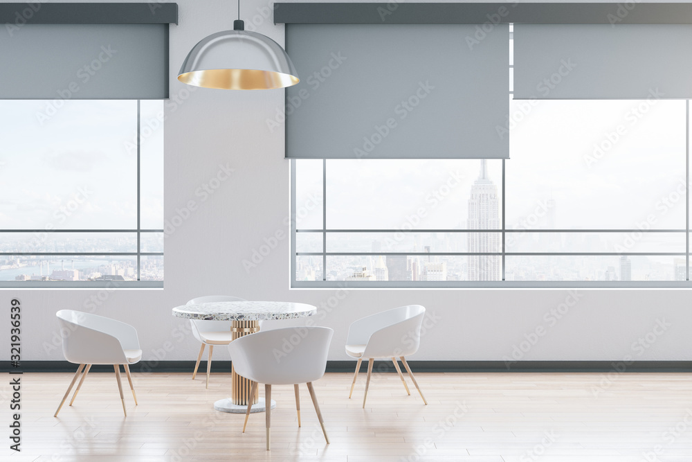 White waiting room with four chairs